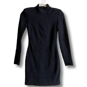 Little black dress with long sleeves.